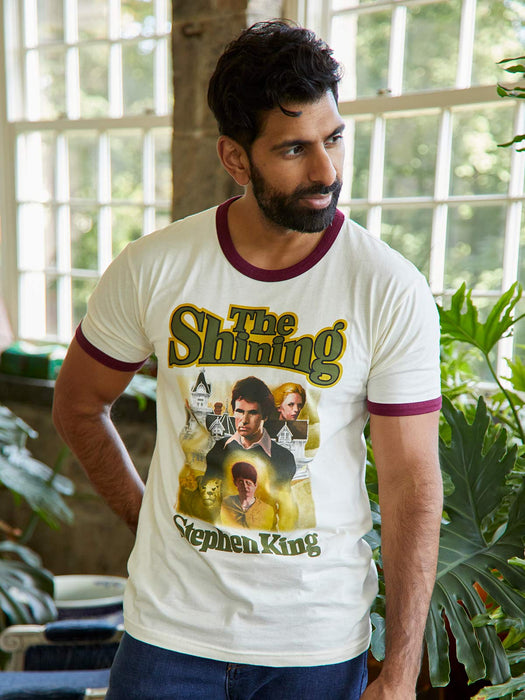 Man wearing a 'The Shining' t-shirt indoors