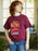 Person wearing a maroon t-shirt with 'Stephen King Carrie' design.
