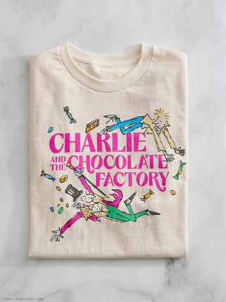 Beige t-shirt with 'Charlie and the Chocolate Factory' graphic design on a marble surface