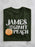 Green t-shirt with 'James and the Giant Peach' text and peach graphic on a marble surface