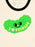 A close-up of a cream-colored ringer t-shirt featuring a bright green pickle-shaped graphic with a cute face and the text 'I [heart] PICKLES' in yellow, with a forest green collar.
