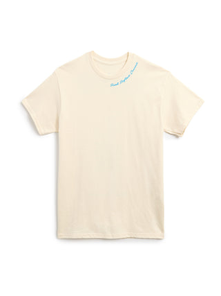 A cream-colored short-sleeve t-shirt with a small light blue cursive graphic 'Read. Reflect. Connect.' on the upper chest, displayed flat against a solid white background.