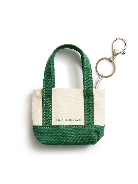 A small canvas tote keychain bag with dark green handles and bottom trim, and an off-white center panel, shown on a white background with a brass key ring and clasp attached.