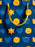 A close-up of a dark blue patterned surface with yellow ribbon handles and repeated yellow and blue holiday-style icons, including stars, hearts, dreidels, and menorahs.