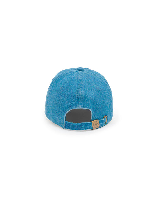A blue denim baseball cap shown from the back, featuring a dark gray fabric lining in the back opening and a small tan leather brand tag on the side.