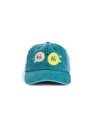 Teal cap with 'hi' speech bubble graphics on a white background
