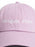 A light pink dad hat baseball cap with 'dragon rider' embroidered in white script across the front panels.