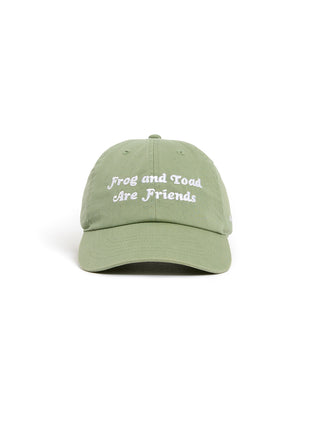 A green baseball cap with white embroidered text reading 'Frog and Toad Are Friends' on the front, shown against a plain white background.
