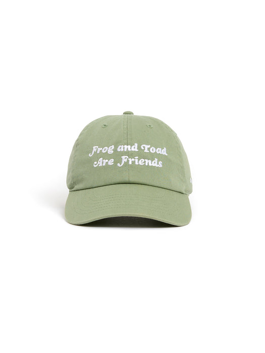 A green baseball cap with white embroidered text reading 'Frog and Toad Are Friends' on the front, shown against a plain white background.