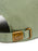 Close-up of the back strap of a green cap with a brass buckle featuring a stylized 'Z' logo.