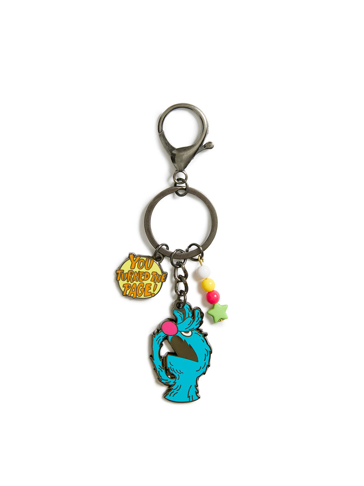 Keychain with cartoon character and colorful charms on a white background