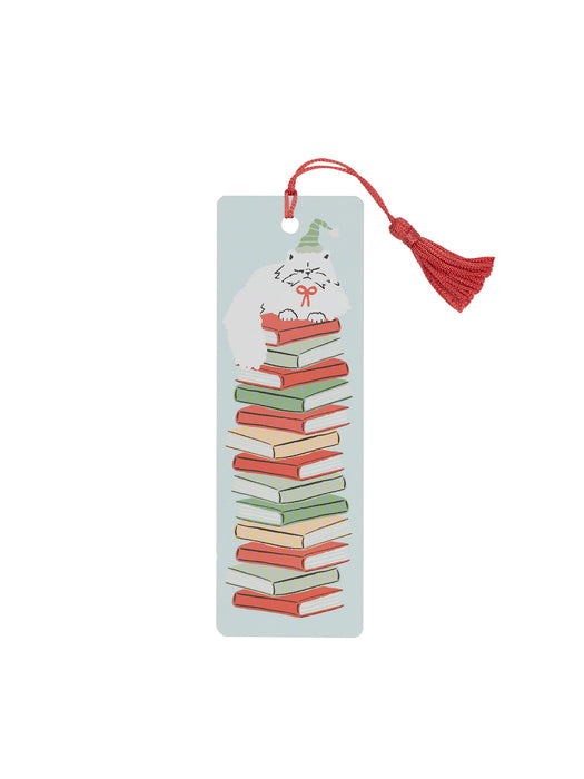 Bookmark with a cat on books design and red tassel on a light blue background