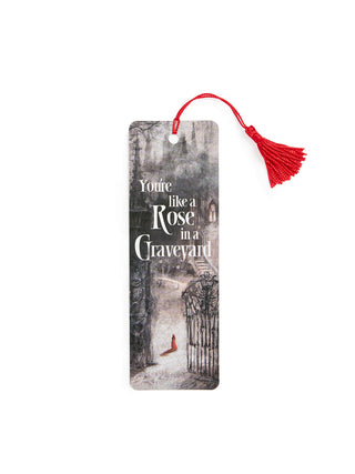 Bookmark with a design of a rose in a graveyard and text, on a white background.