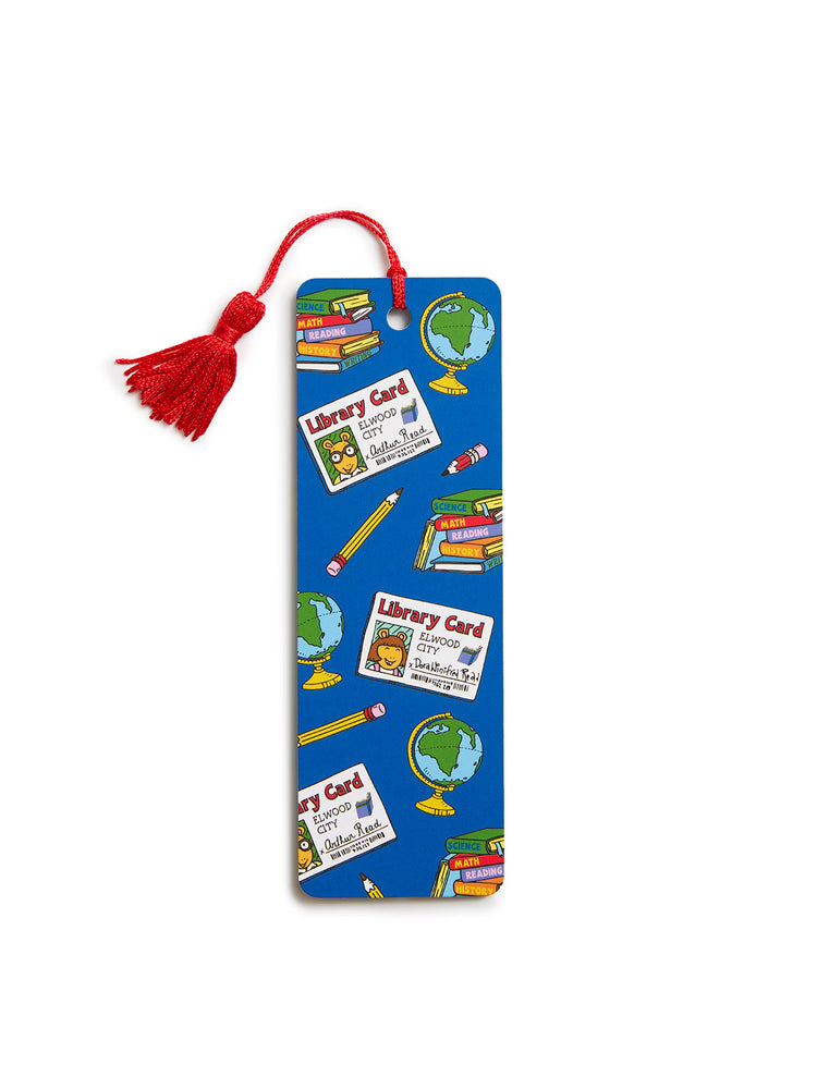 A blue paper bookmark with a red tassel, decorated with illustrations of library cards, books, globes, and pencils on a white background.