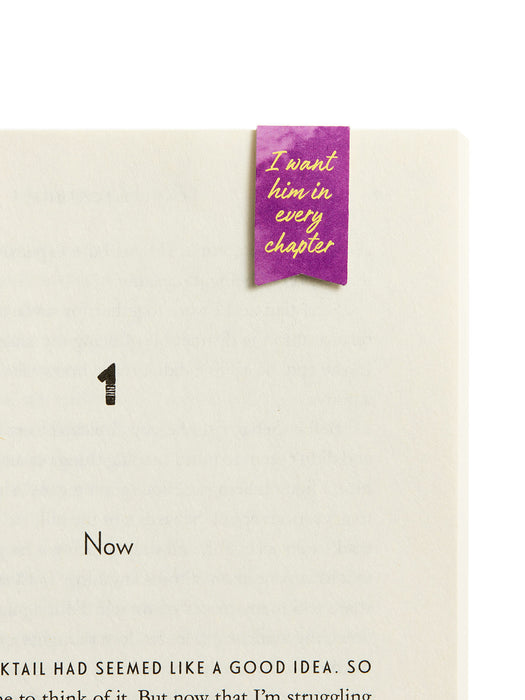 Book with a purple bookmark inside, displaying text on a white background