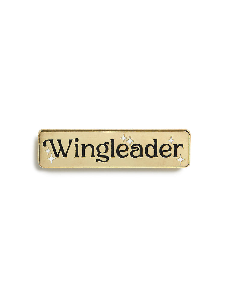 Gold nameplate with 'Wingleader' text on a white background