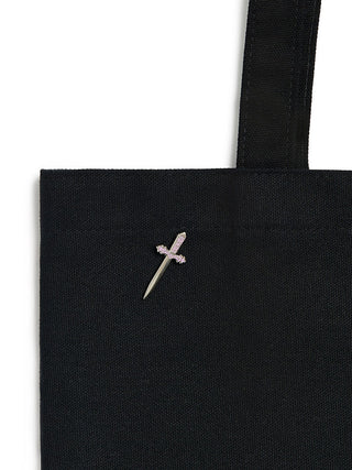 Black tote bag with a small embroidered design on a white background