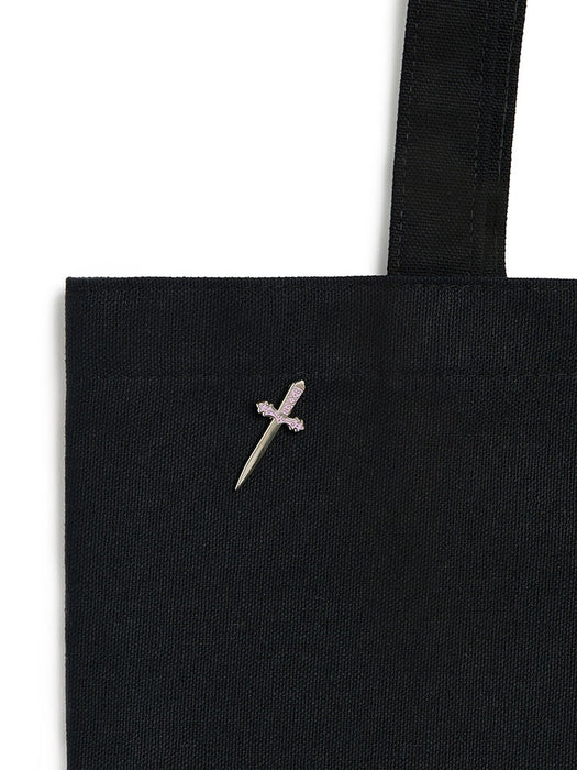 Black tote bag with a small embroidered design on a white background