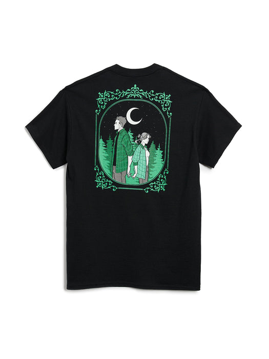Black t-shirt with a graphic of two people under a moonlit sky in a forest, framed by green leaves on a white background.