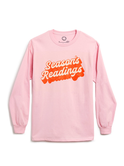 A light pink long-sleeve shirt with a retro-style graphic reading 'Season's Readings' across the chest, displayed on a clean white background.