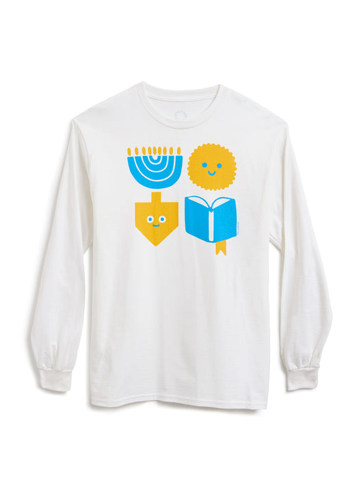 A white long-sleeve crewneck t-shirt featuring a colorful graphic of Hanukkah symbols (a blue menorah, a yellow latke, a yellow dreidel with a face, and a blue book) on the front, displayed against a clean white background.