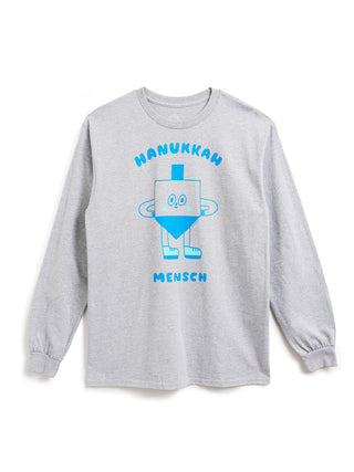 A light gray long-sleeve t-shirt with a blue graphic of a dreidel character and the text 'HANUKKAN MENSCH' printed on the front, displayed against a plain white background.