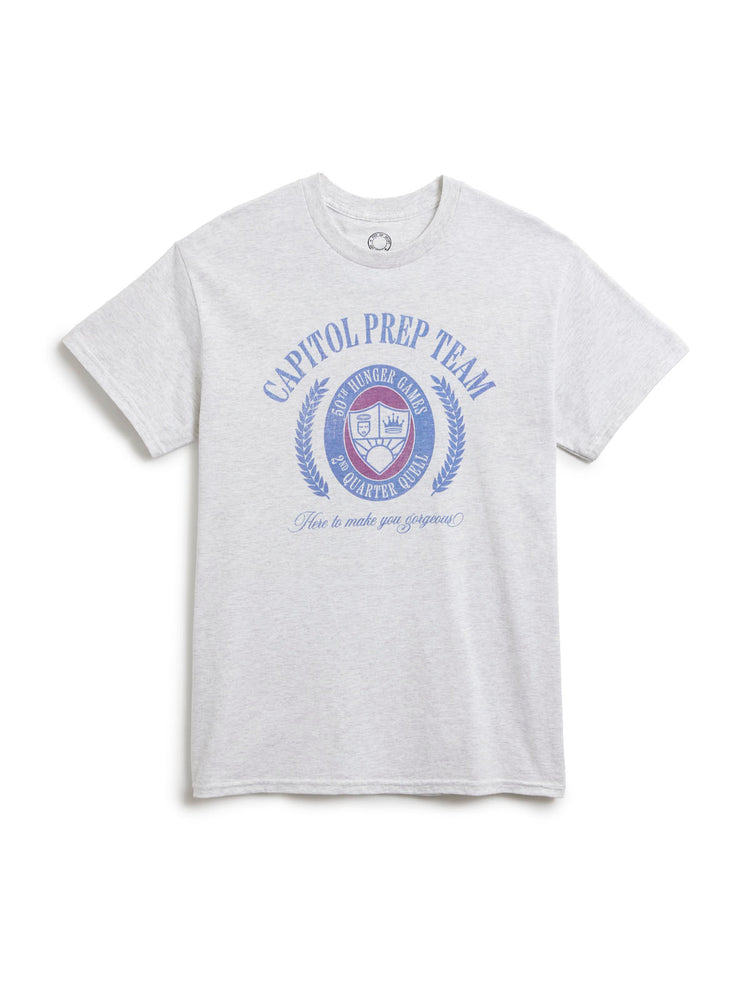 A light heather gray short-sleeve t-shirt with a blue and red graphic on the front reading 'CAPITOL PREP TEAM' and 'Here to make you gorgeous!' on a white background.