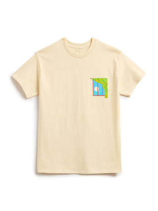 A light beige crewneck t-shirt with a small colorful graphic on the left chest depicting a window, a blue sky, and a full moon, shown on a plain white background.