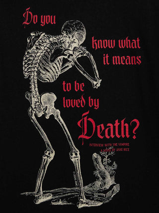 A black graphic print featuring a white skeleton figure and red gothic text reading, 'Do you know what it means to be loved by Death?' with smaller text below reading 'Interview with the Vampire' and 'A Novel by Anne Rice.'.