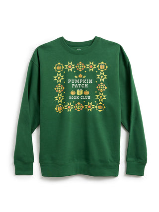 A green crewneck sweatshirt featuring a 'Pumpkin Patch Book Club' graphic on the chest, surrounded by a decorative border of pumpkins and geometric patterns in yellow, orange, and white.