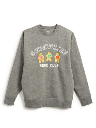 A heather gray crewneck sweatshirt featuring a graphic on the front that reads 'GINGERBREAD BOOK CLUB' in white arched text above three gingerbread characters holding books, shown against a plain white background.