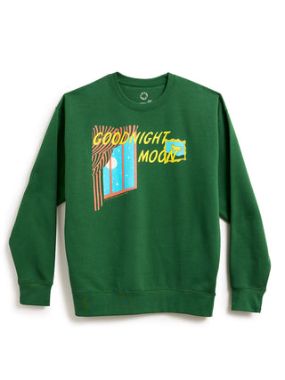 A green crewneck sweatshirt featuring a colorful graphic print on the front with the text 'GOOD NIGHT MOON' and a stylized moon illustration, displayed against a plain white background.