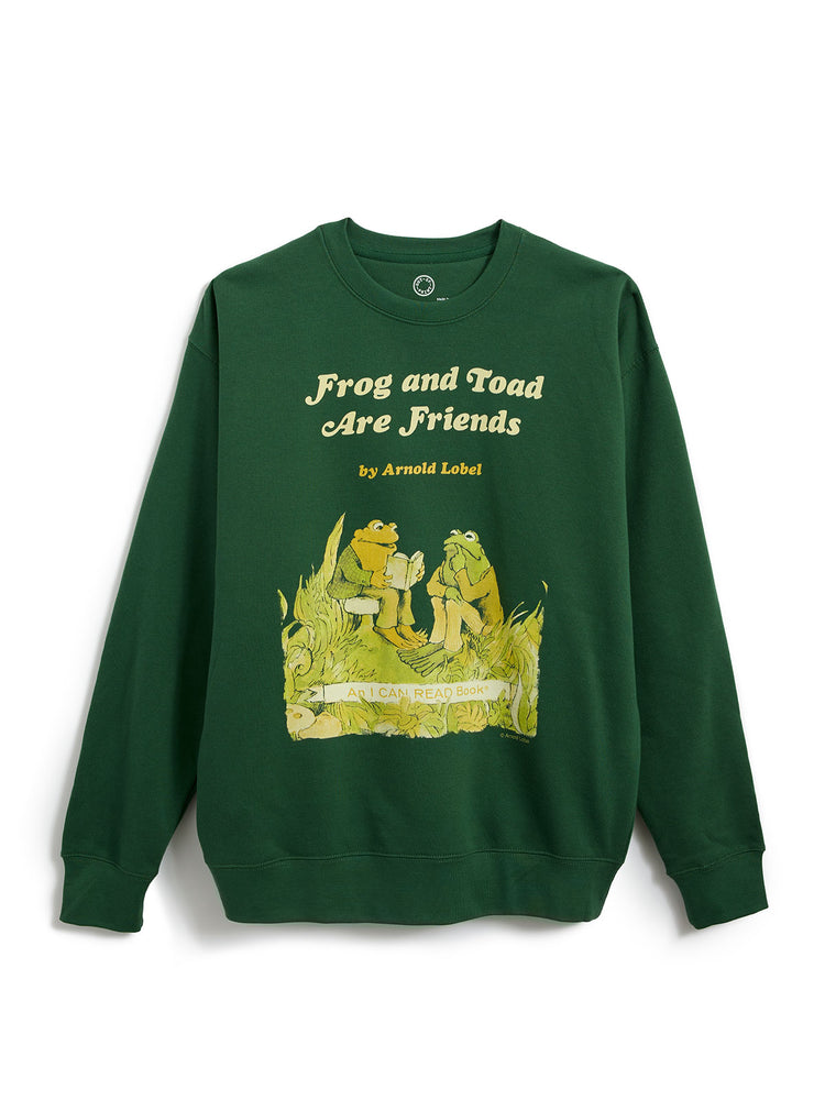 A dark green crewneck sweatshirt featuring a graphic print of the 'Frog and Toad Are Friends' book cover by Arnold Lobel, displayed flat against a white background.