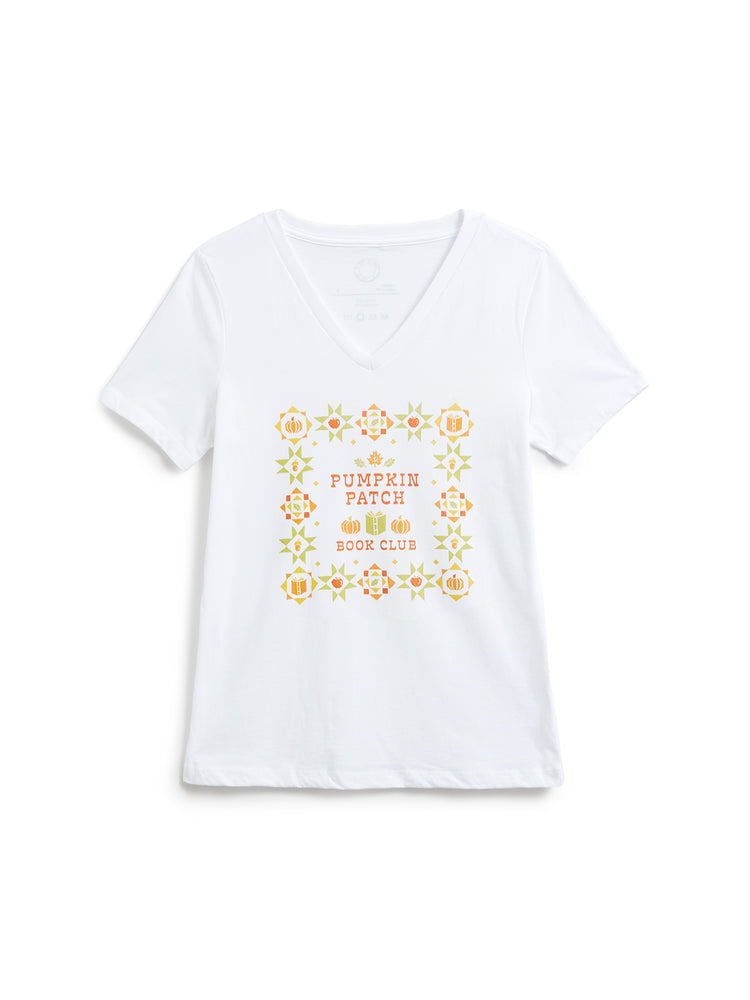 A white short-sleeve V-neck t-shirt with a colorful graphic on the front featuring autumn-themed illustrations and the text 'Pumpkin Patch Book Club'.