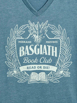 A close-up of a heather blue V-neck t-shirt featuring a distressed white graphic print of a dragon head, laurel wreath, and an open book with the text 'BASGIATH Book Club' and 'READ OR DIE!'.