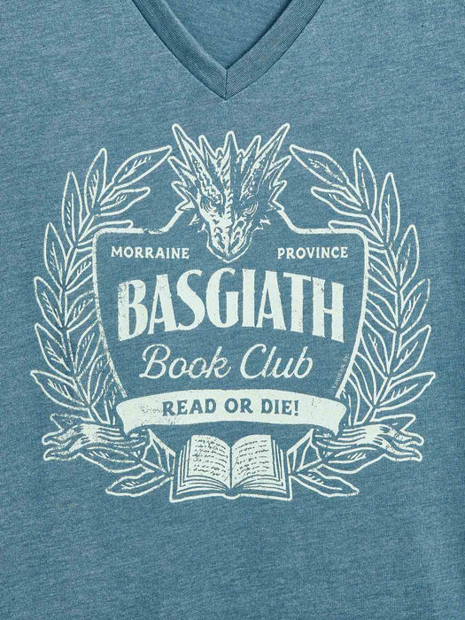 A close-up of a heather blue V-neck t-shirt featuring a distressed white graphic print of a dragon head, laurel wreath, and an open book with the text 'BASGIATH Book Club' and 'READ OR DIE!'.
