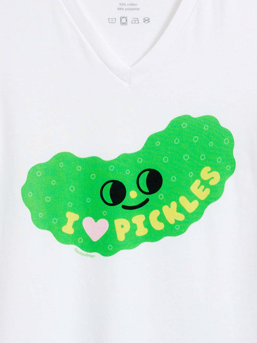 A close-up of a white v-neck t-shirt featuring a green pickle graphic with a smiling face and the text 'I [heart] PICKLES' in yellow.