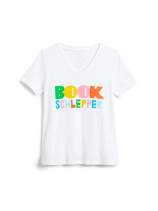 A white short-sleeve V-neck T-shirt with the text 'BOOK SCHLEPPER' printed across the chest in colorful, playful letters, displayed on a clean white background.