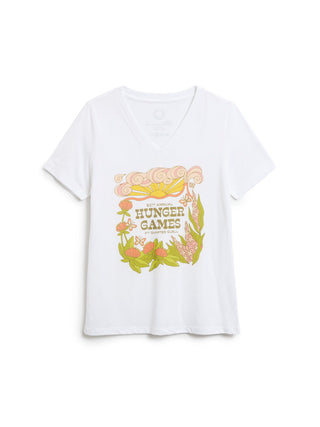 A white short-sleeve V-neck t-shirt featuring a colorful graphic print on the front with the words 'Hunger Games' surrounded by flowers and leaves.