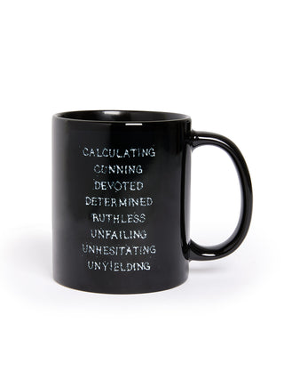 Black mug with motivational text on a white background