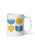 A white ceramic mug featuring a colorful graphic of a blue menorah, a yellow latke, a yellow dreidel, and a blue book with a yellow bookmark.