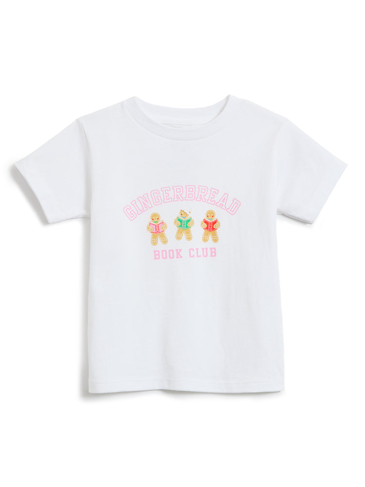 A white short-sleeve kids' t-shirt featuring a 'Gingerbread Book Club' graphic on the chest with three gingerbread illustrations reading books and pink lettering, displayed on a clean white background.