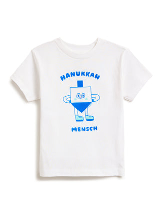 White kids' t-shirt featuring a blue graphic of a smiling dreidel character with the text 'HANUKKAH' above and 'MENSCH' below.