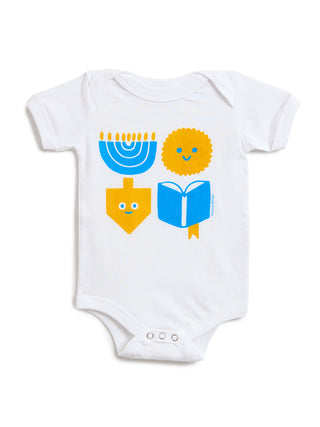 White short-sleeve baby bodysuit with a colorful Hanukkah-themed graphic print featuring a blue menorah, yellow dreidel, yellow latke, and blue book.