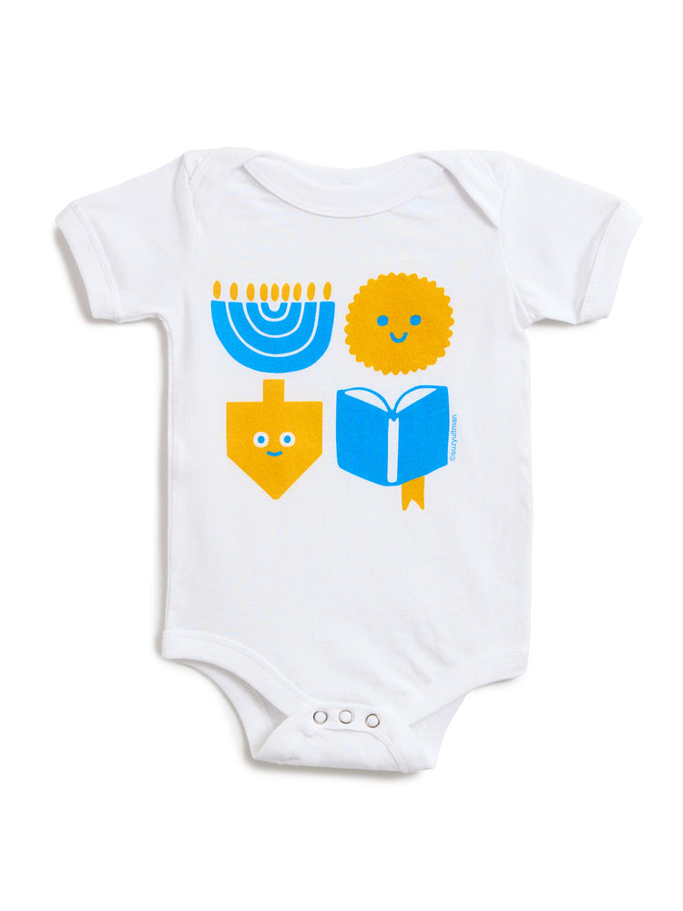 White short-sleeve baby bodysuit with a colorful Hanukkah-themed graphic print featuring a blue menorah, yellow dreidel, yellow latke, and blue book.