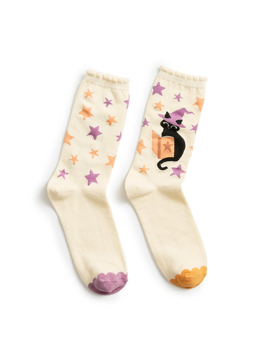 Pair of socks with star and cat designs on a white background