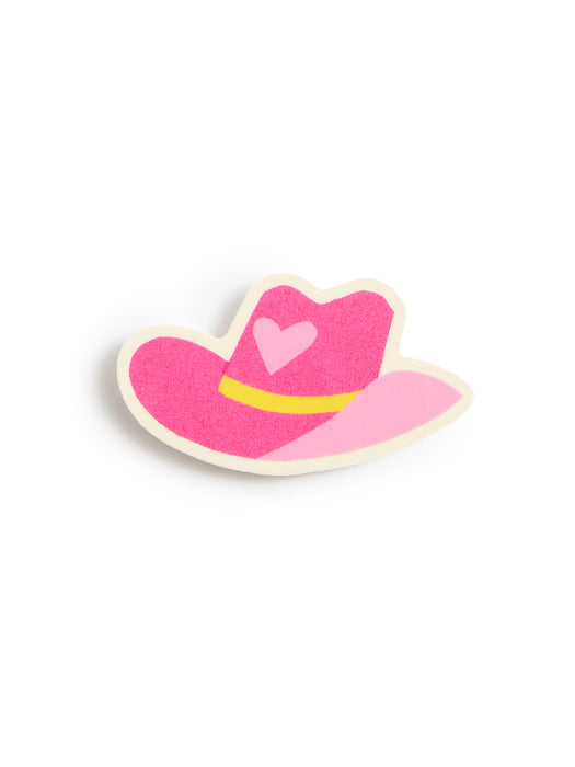 A pink felt cowboy hat pin with a yellow band and a light pink heart on the crown, set against a plain white background.