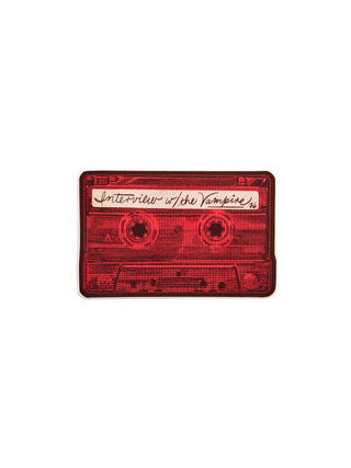 A red cassette tape sticker featuring the text 'Interview w/ the Vampire' on the label, shown on a plain white background.