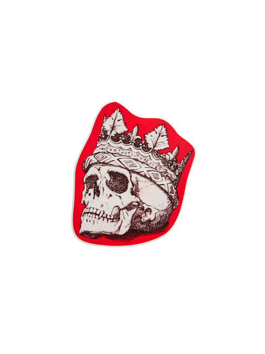 A red sticker featuring a detailed white and black illustration of a skull wearing a crown, set against a plain white background.