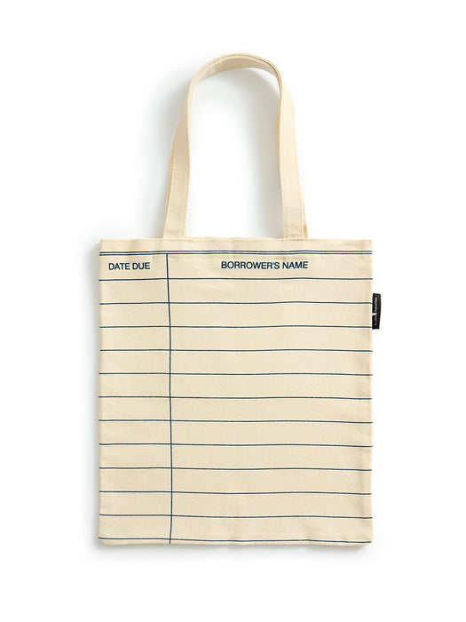 A cream-colored canvas tote bag designed to look like a lined notebook page, featuring dark blue horizontal lines, a vertical margin line, and printed text reading 'DATE DUE' and 'BORROWER'S NAME'. It has two matching cream fabric handles and a small black brand tag on the right side.